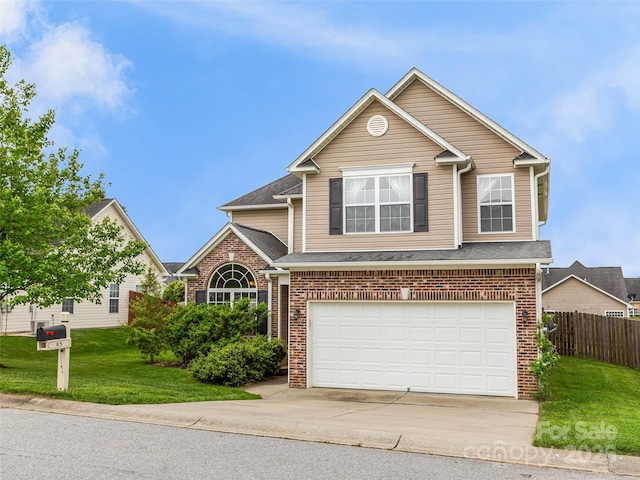 85 Lumber River Rd, Fletcher, NC 28732 - traditional-style home featuring driveway, an attached garage, brick siding, and roof with shingles