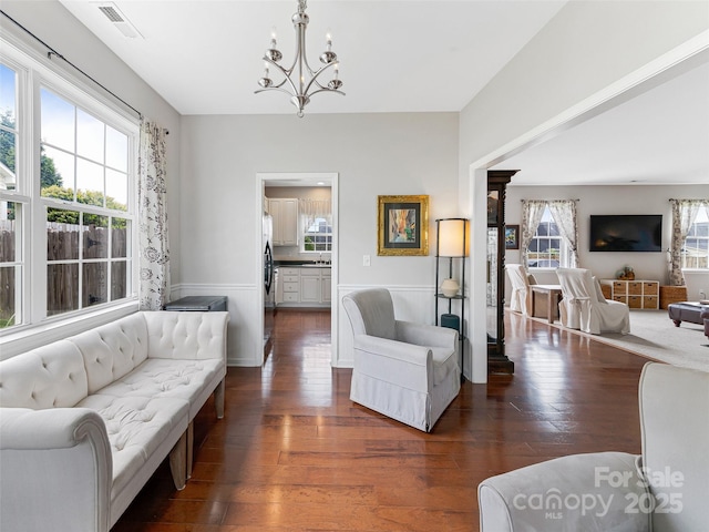 85 Lumber River Rd, Fletcher, NC 28732 - living room featuring a chandelier, dark wood-style floors, and a wainscoted wall