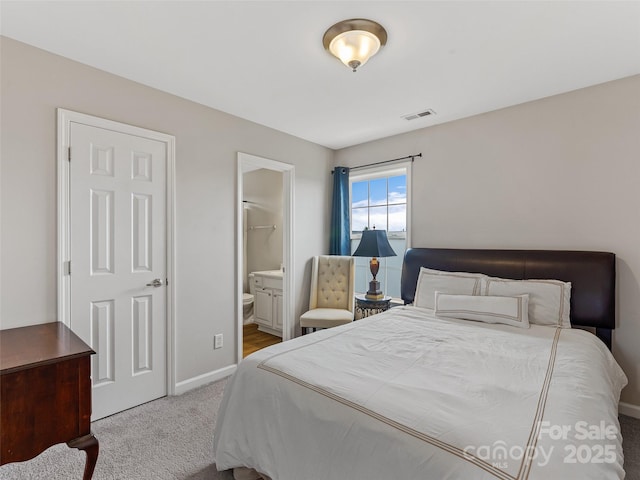 85 Lumber River Rd, Fletcher, NC 28732 - carpeted bedroom featuring baseboards and connected bathroom