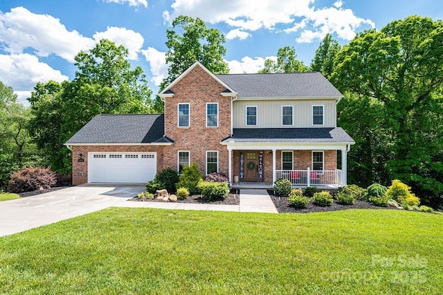 view of front facade with covered porch, driveway, an attached garage, a front lawn, and brick siding