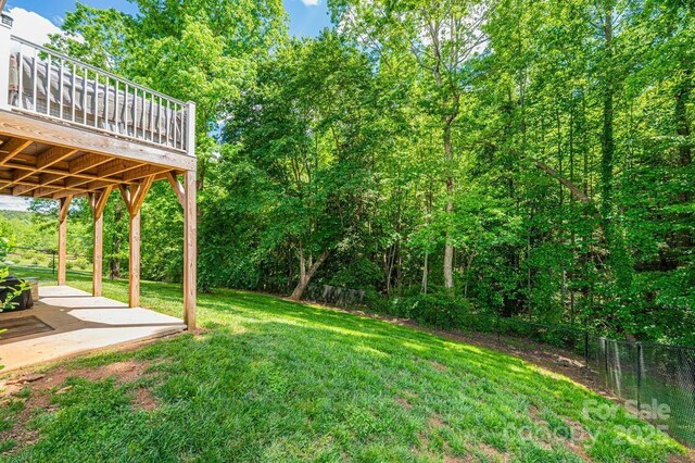view of yard with a patio and a deck