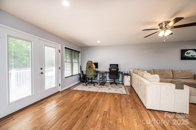 office area with french doors, healthy amount of natural light, wood finished floors, and recessed lighting