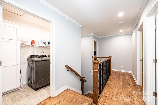 hallway featuring an upstairs landing, light wood finished floors, crown molding, baseboards, and recessed lighting