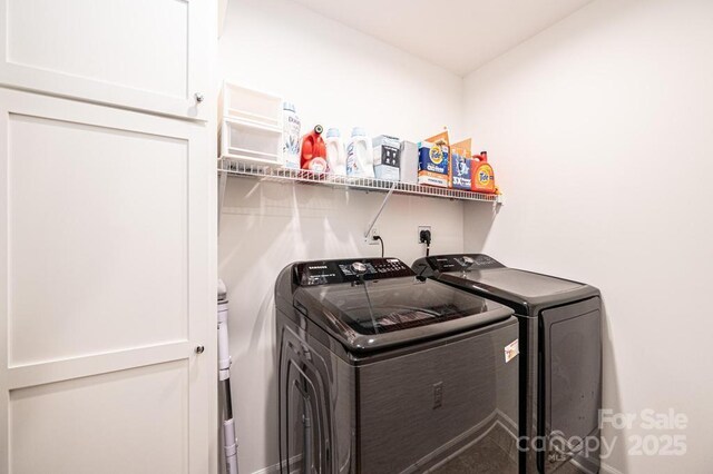 washroom with washer and dryer