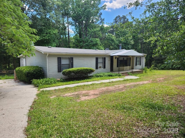 ranch-style house with a front lawn