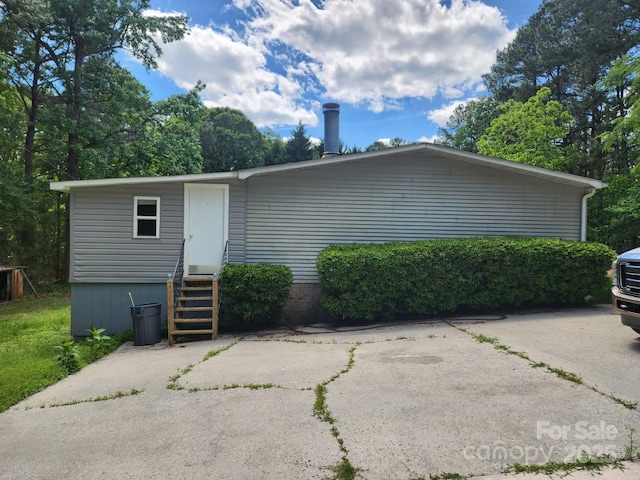 rear view of house with entry steps