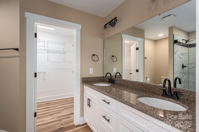 355 Northbrook Iii School Rd Unit 10, Vale, NC 28164 - full bath featuring a stall shower, a spacious closet, toilet, wood finished floors, and double vanity