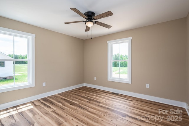 355 Northbrook Iii School Rd Unit 10, Vale, NC 28164 - unfurnished room featuring healthy amount of natural light, baseboards, wood finished floors, and ceiling fan