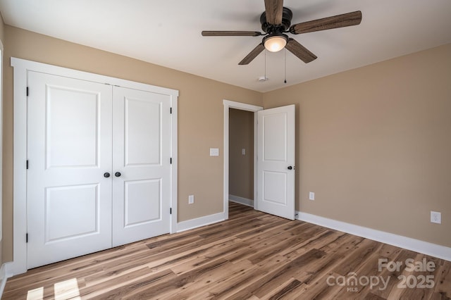 355 Northbrook Iii School Rd Unit 10, Vale, NC 28164 - unfurnished bedroom featuring baseboards, light wood-type flooring, a closet, and a ceiling fan
