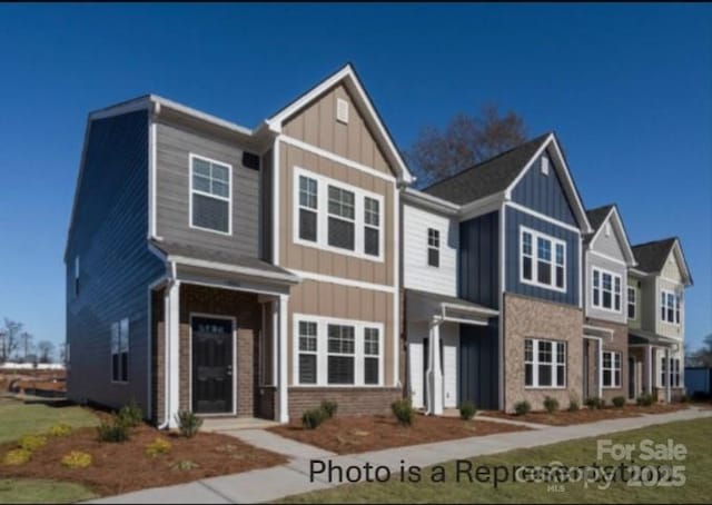 487 Shasta St Unit 5203, Gastonia, NC 28052 - view of front of house featuring board and batten siding and brick siding