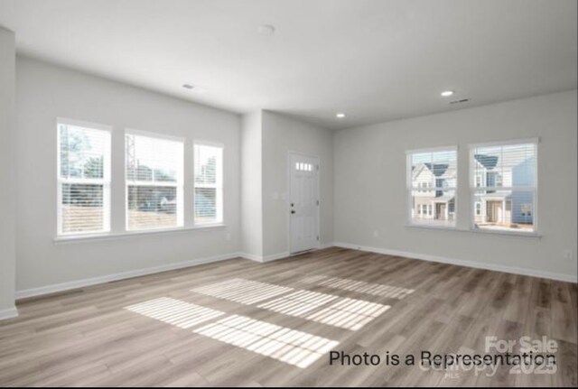 487 Shasta St Unit 5203, Gastonia, NC 28052 - unfurnished living room featuring light wood-style floors, recessed lighting, and baseboards