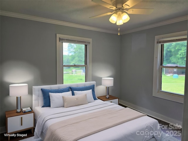 bedroom featuring crown molding, baseboards, ceiling fan, and wood finished floors