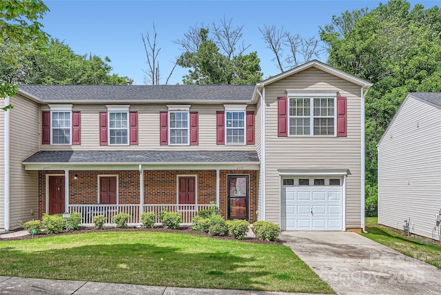 6335 Ziegler Ln, Charlotte, NC 28269 - view of front of home featuring an attached garage, driveway, a porch, a front lawn, and a shingled roof