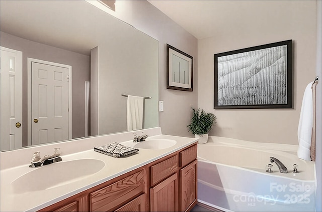 6335 Ziegler Ln, Charlotte, NC 28269 - bathroom featuring a bath and double vanity