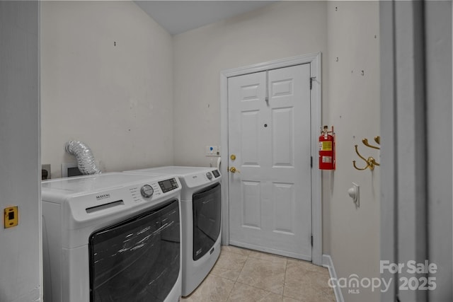 301 Garner Dr, Salisbury, NC 28146 - laundry room featuring washer and dryer and light tile patterned floors