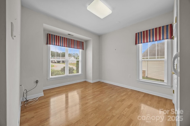301 Garner Dr, Salisbury, NC 28146 - spare room featuring light wood-type flooring and baseboards