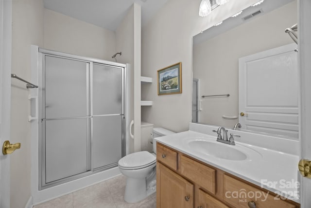 301 Garner Dr, Salisbury, NC 28146 - bathroom featuring a stall shower, tile patterned flooring, toilet, and vanity