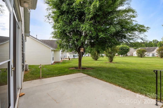 301 Garner Dr, Salisbury, NC 28146 - view of green lawn with a patio and central AC