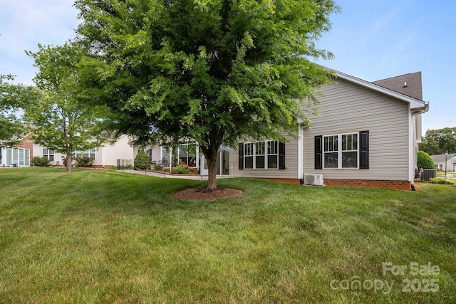 301 Garner Dr, Salisbury, NC 28146 - rear view of property with central AC and a lawn