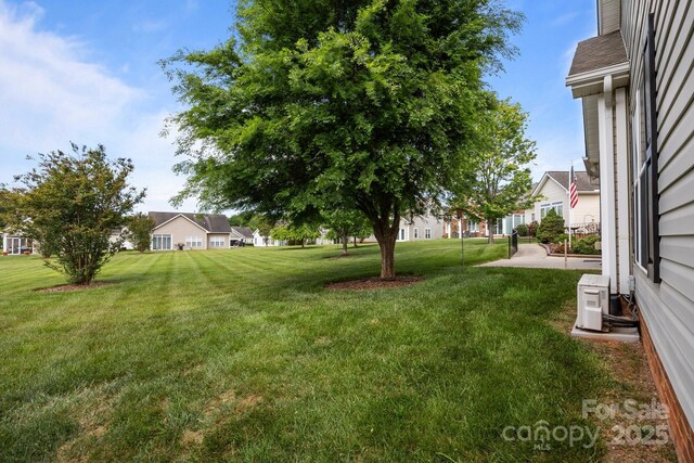 301 Garner Dr, Salisbury, NC 28146 - view of green lawn with a residential view and ac unit