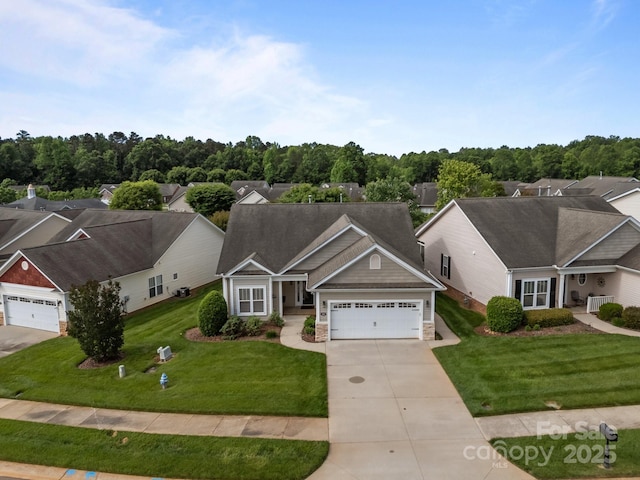 301 Garner Dr, Salisbury, NC 28146 - view of front of home featuring a garage, driveway, a front lawn, and stone siding