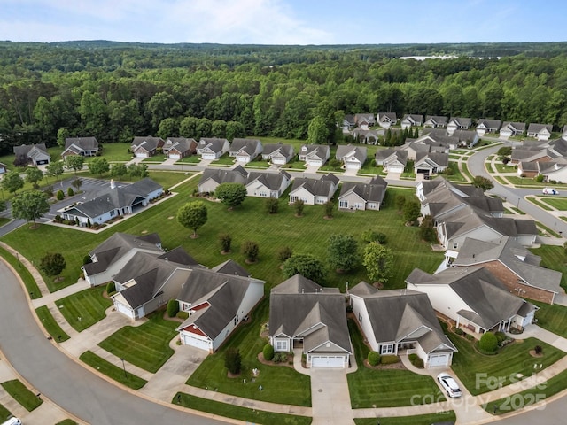 301 Garner Dr, Salisbury, NC 28146 - aerial view of property and surrounding area with nearby suburban area and a forest