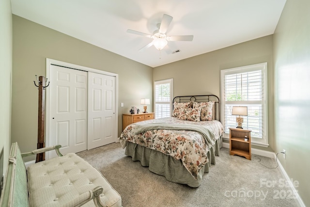 12039 Lawings Corner Dr, Huntersville, NC 28078 - bedroom with light carpet, a closet, ceiling fan, and baseboards