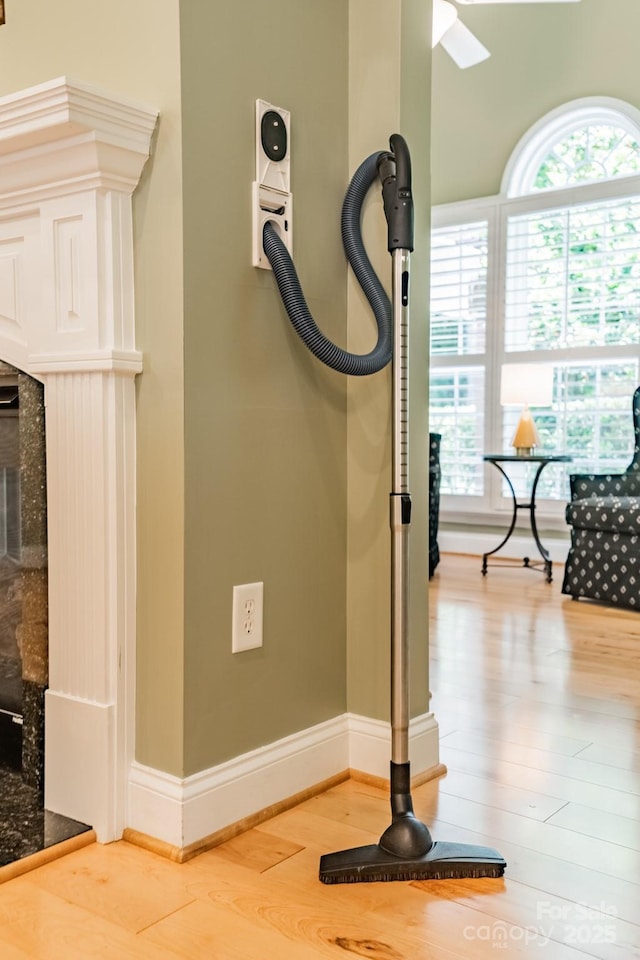 12039 Lawings Corner Dr, Huntersville, NC 28078 - detailed view of wood finished floors, a fireplace with raised hearth, and baseboards