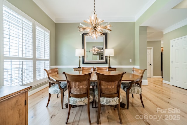 12039 Lawings Corner Dr, Huntersville, NC 28078 - dining room with a chandelier, light wood-style floors, ornamental molding, and healthy amount of natural light