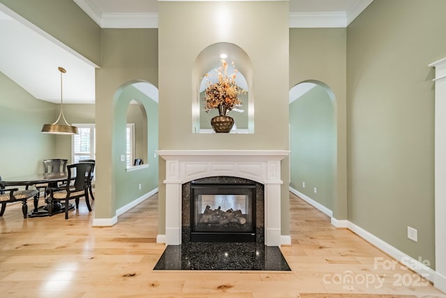 12039 Lawings Corner Dr, Huntersville, NC 28078 - detailed view of wood finished floors, a multi sided fireplace, baseboards, and ornamental molding