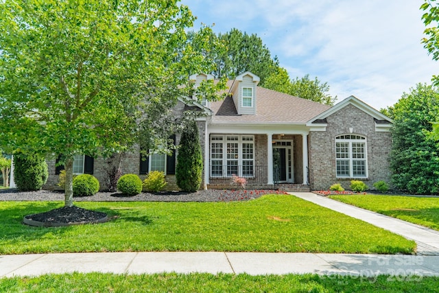 12039 Lawings Corner Dr, Huntersville, NC 28078 - view of front of house with a front yard, brick siding, and a porch