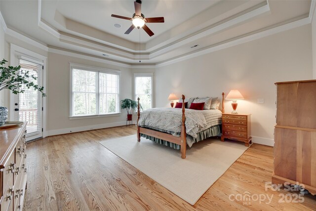 18311 Rosapenny Rd, Charlotte, NC 28278 - bedroom with a raised ceiling, access to exterior, light wood-style floors, ornamental molding, and baseboards
