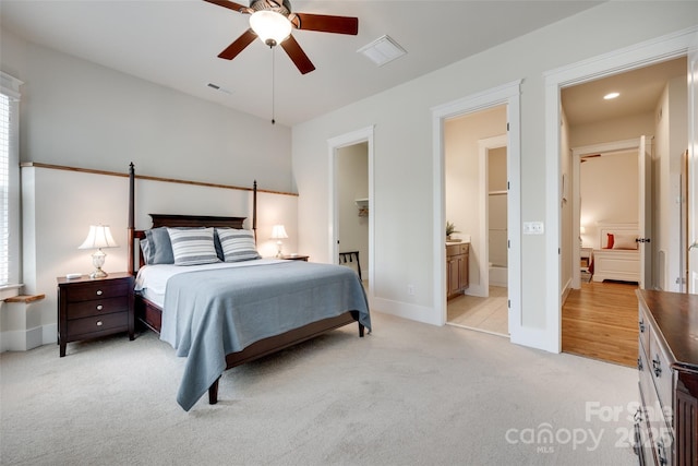18311 Rosapenny Rd, Charlotte, NC 28278 - bedroom with light carpet, baseboards, ensuite bath, and multiple windows