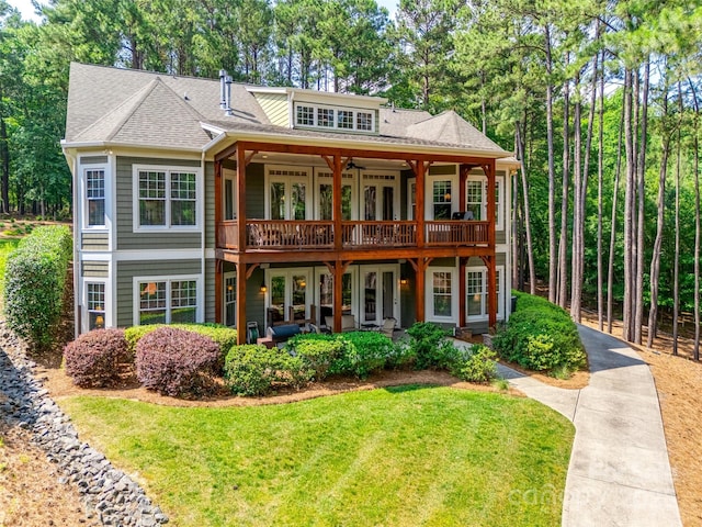 18311 Rosapenny Rd, Charlotte, NC 28278 - view of front of property featuring a front yard, french doors, ceiling fan, a deck, and a shingled roof