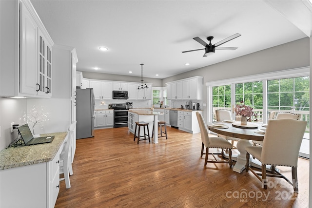 230 Fairway Falls Rd, Mills River, NC 28759 - dining space featuring a ceiling fan, recessed lighting, and wood finished floors