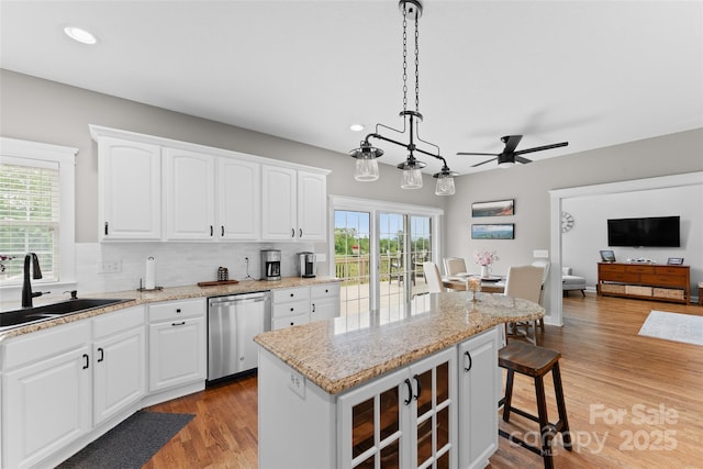 230 Fairway Falls Rd, Mills River, NC 28759 - kitchen with stainless steel dishwasher, a sink, ceiling fan, recessed lighting, and backsplash