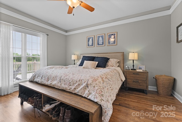 230 Fairway Falls Rd, Mills River, NC 28759 - bedroom featuring multiple windows, wood finished floors, ornamental molding, and a ceiling fan