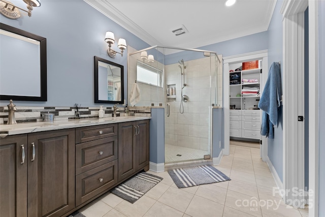 230 Fairway Falls Rd, Mills River, NC 28759 - full bath featuring a shower stall, double vanity, ornamental molding, tile patterned floors, and a walk in closet