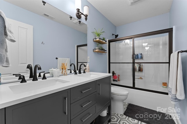 230 Fairway Falls Rd, Mills River, NC 28759 - full bath featuring double vanity, combined bath / shower with glass door, and toilet