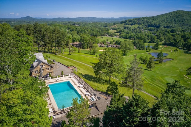 230 Fairway Falls Rd, Mills River, NC 28759 - bird's eye view of a water and mountain view, a pool area, and a heavily wooded area