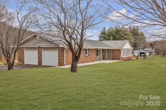 276 Bob Mcneill Rd, West Jefferson, NC 28694 - view of front of property with driveway, a front yard, brick siding, metal roof, and a garage