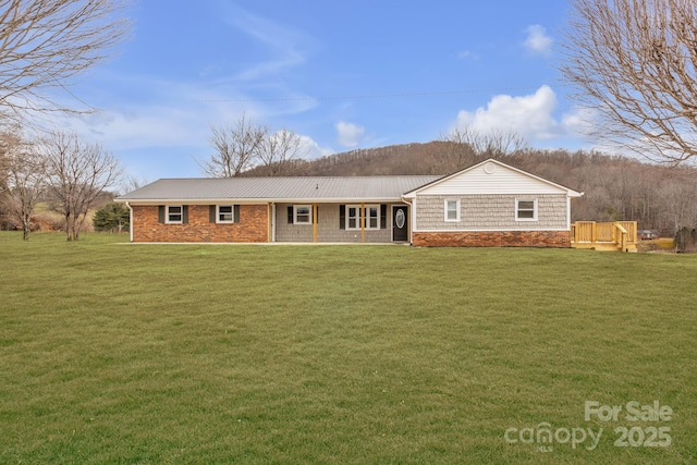276 Bob Mcneill Rd, West Jefferson, NC 28694 - rear view of house featuring a yard and metal roof