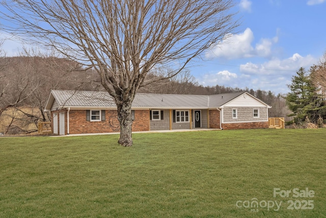 276 Bob Mcneill Rd, West Jefferson, NC 28694 - view of front of property with a front yard, metal roof, and brick siding