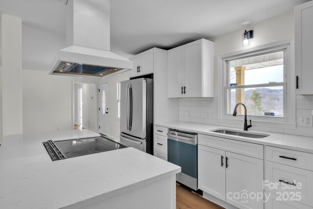 276 Bob Mcneill Rd, West Jefferson, NC 28694 - kitchen with stainless steel appliances, range hood, a sink, white cabinetry, and tasteful backsplash
