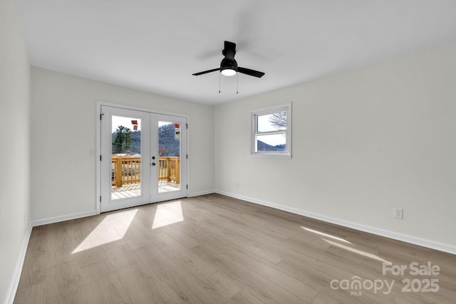 276 Bob Mcneill Rd, West Jefferson, NC 28694 - empty room with french doors, wood finished floors, and baseboards