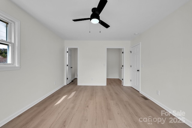 276 Bob Mcneill Rd, West Jefferson, NC 28694 - unfurnished bedroom with light wood-type flooring, baseboards, and ceiling fan