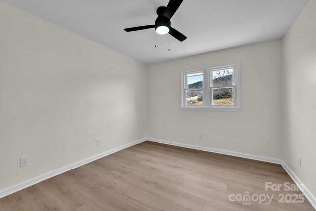 276 Bob Mcneill Rd, West Jefferson, NC 28694 - empty room featuring wood finished floors, baseboards, and a ceiling fan