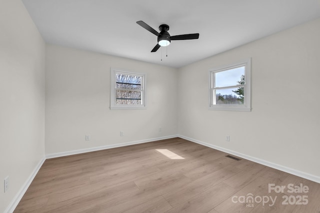 276 Bob Mcneill Rd, West Jefferson, NC 28694 - empty room with plenty of natural light, wood finished floors, ceiling fan, and baseboards