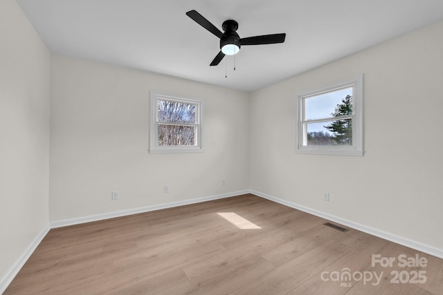 276 Bob Mcneill Rd, West Jefferson, NC 28694 - empty room featuring healthy amount of natural light, wood finished floors, baseboards, and a ceiling fan