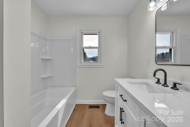 276 Bob Mcneill Rd, West Jefferson, NC 28694 - full bath featuring healthy amount of natural light, vanity, wood finished floors, and toilet